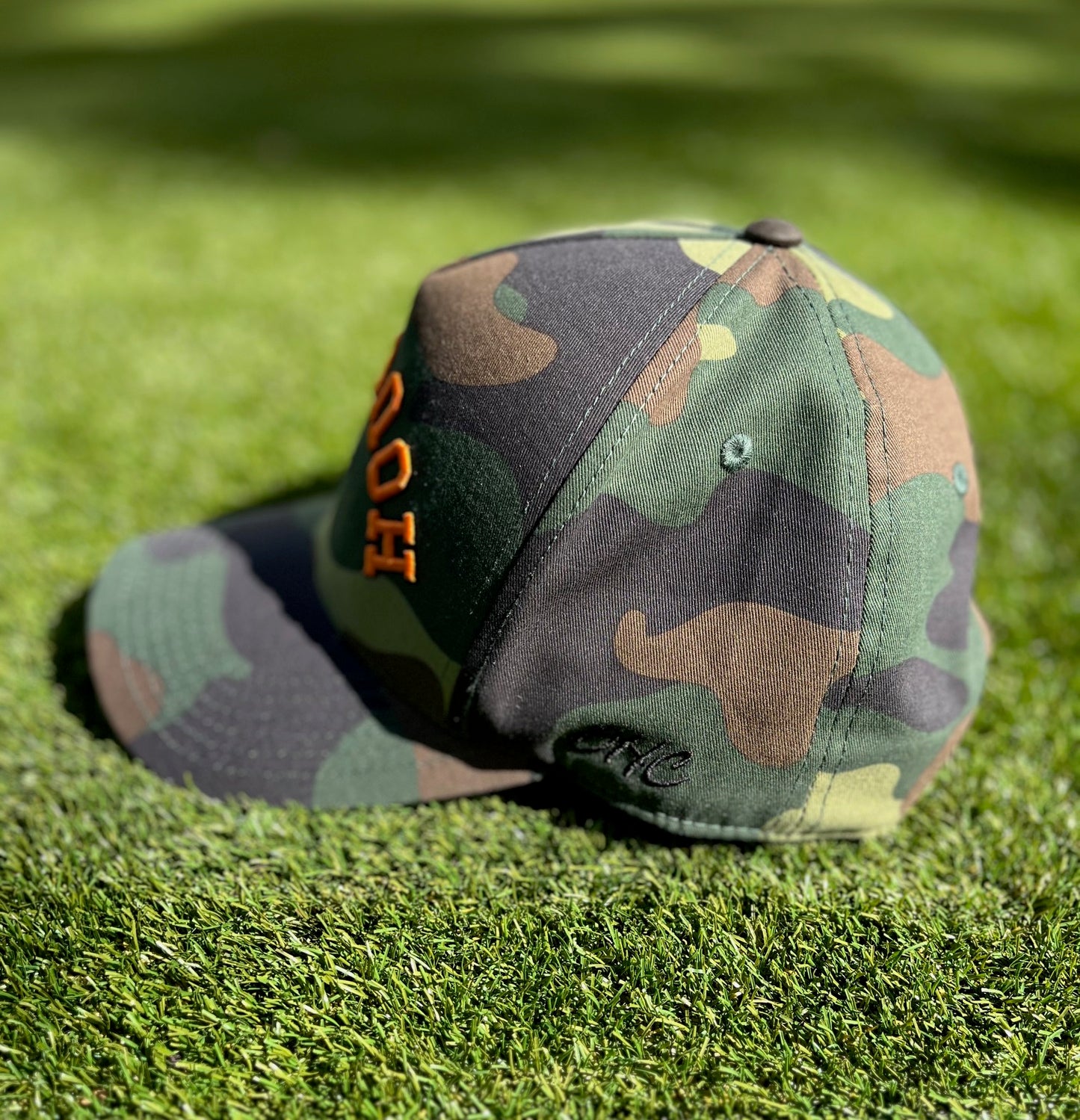 Camo | Camo with Orange & Black Outline Stitching | Pre-curved Snapback